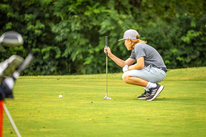 Students play golf